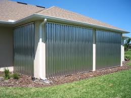 Corrugated aluminum storm panels installed over a home's windows